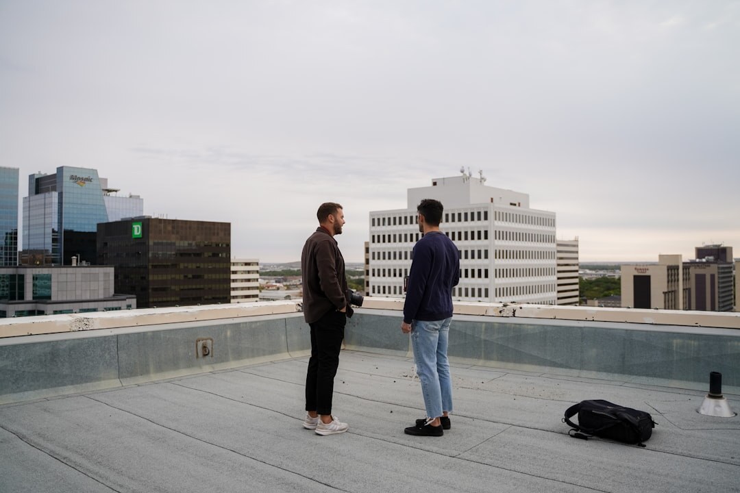 Senior mentor advising a younger entrepreneur in an office
